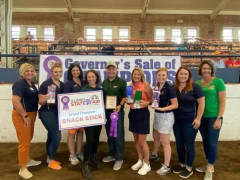 Kris Sterbinsky, owner, and his daughter, Morgan, accepting the award at the Governor's Sale of Champions.